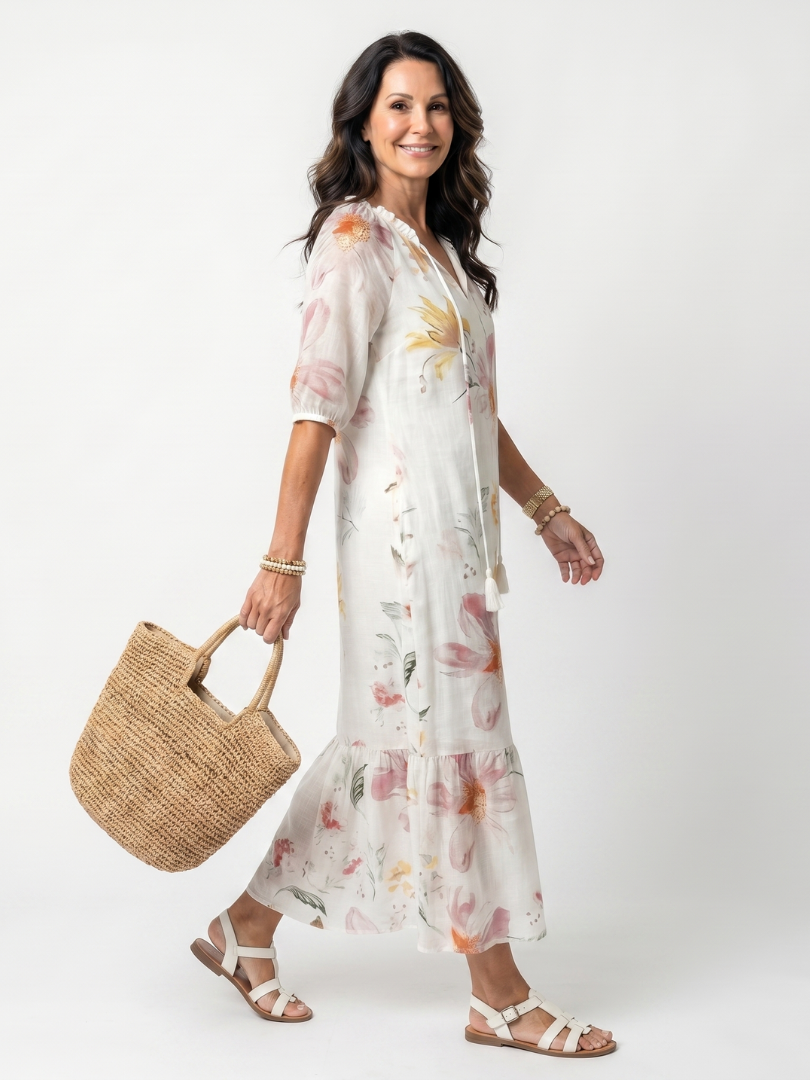 Robe midi florale douce Danoir Paris Noa avec volants et franges, tissu léger et imprimé floral coloré.
