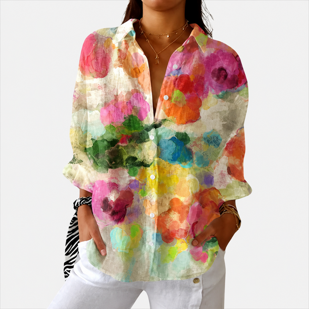 Blouse légère et colorée imprimée de la marque Danoir Paris, avec un motif floral et des manches longues.