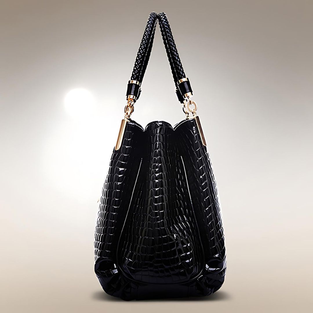 Sac à main en cuir crocodile Lusso Milano de Danoir Paris, élégant et texturé, avec poignées et fermeture métallique.