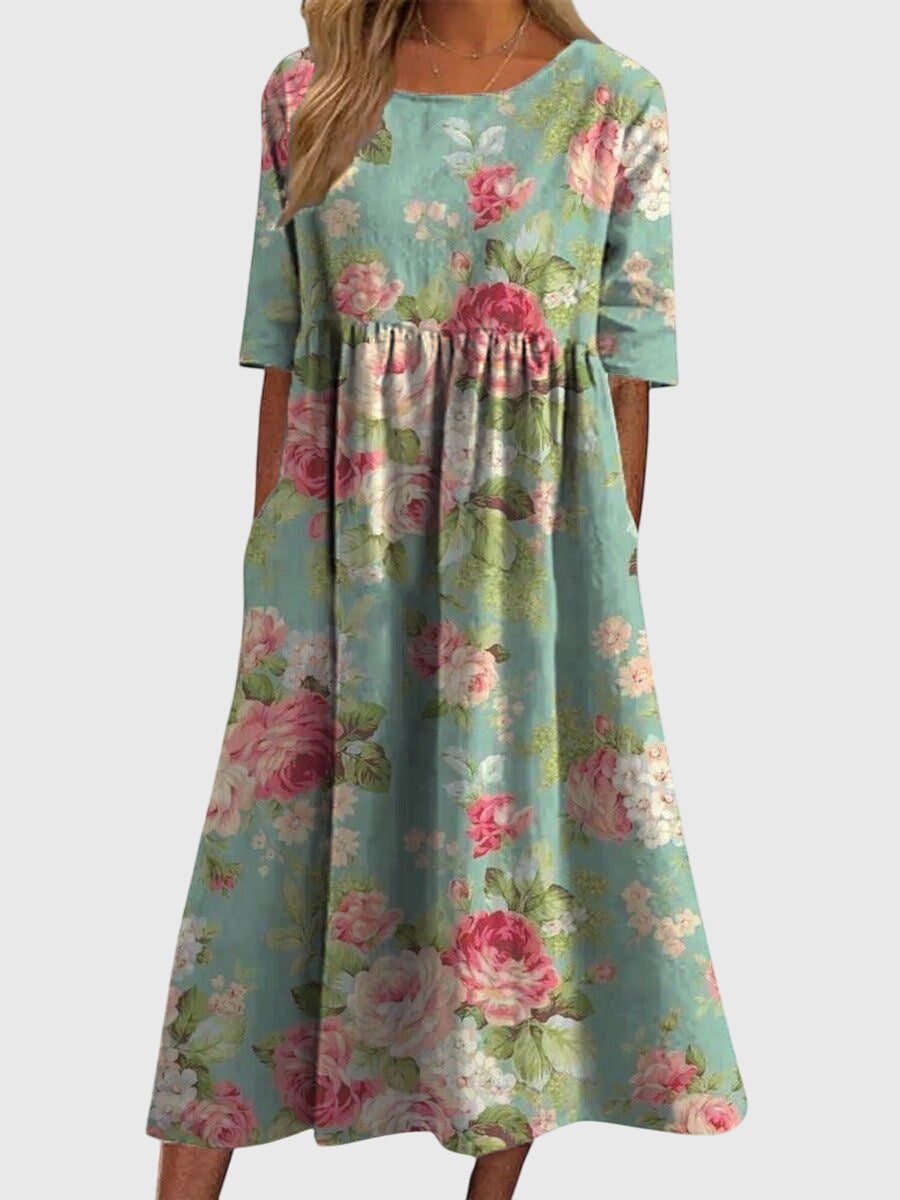 Robe élégante Aleah de Danoir Paris, coupe flatteuse, en tissu fluide, portée par un mannequin dans une tenue chic et sophistiquée.