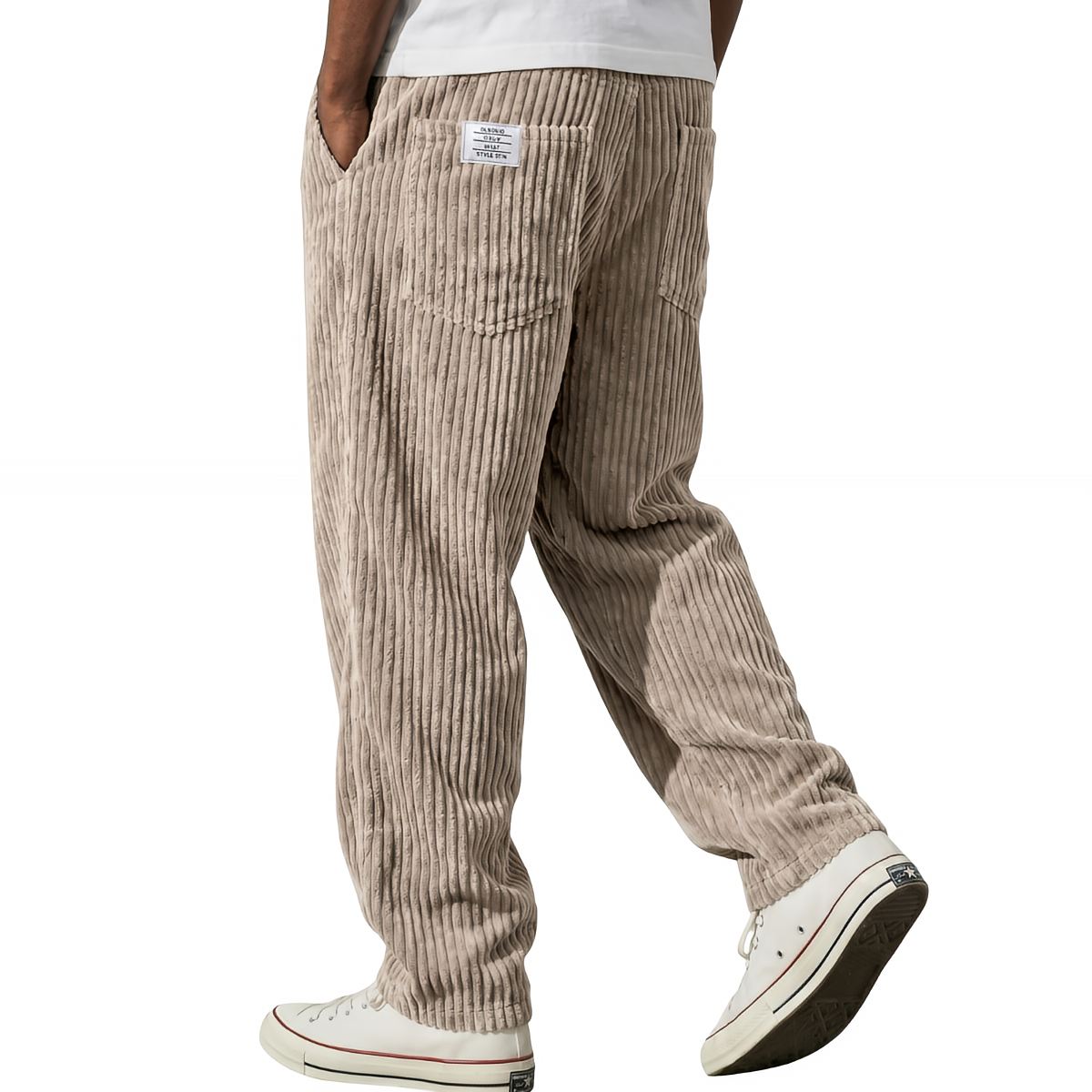 Pantalons en velours côtelé Adriano par Danoir Paris, coupe élégante, couleur neutre, tissu doux et texturé, style moderne.