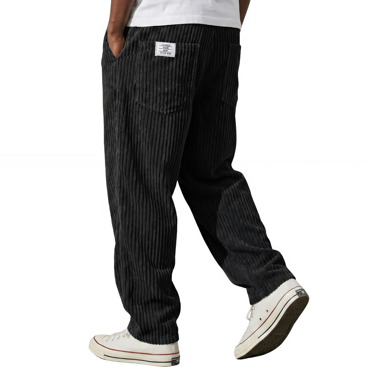 Pantalons en velours côtelé noirs Danoir Paris, coupe moderne, tissu doux et texturé, vue de face sur fond blanc.