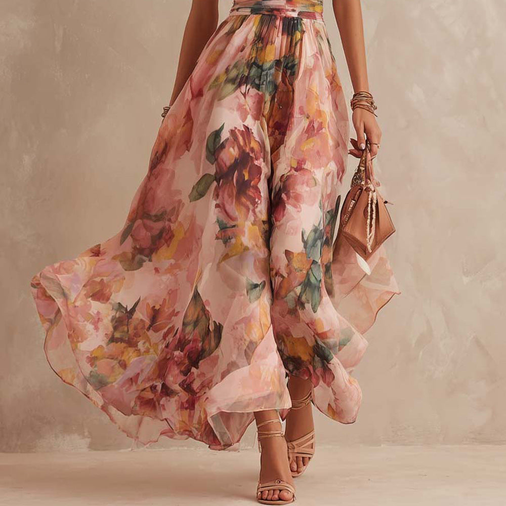 Robe longue femme Aurora de Danoir Paris avec épaule dénudée et motif floral, détail en tissu léger et élégant.
