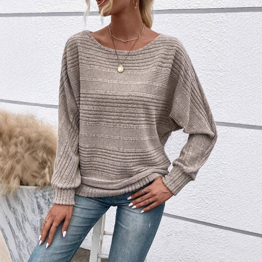 Pull élégant décontracté Seraphine de Danoir Paris, en coton doux, porté sur un mannequin, couleur neutre, style moderne et confortable.
