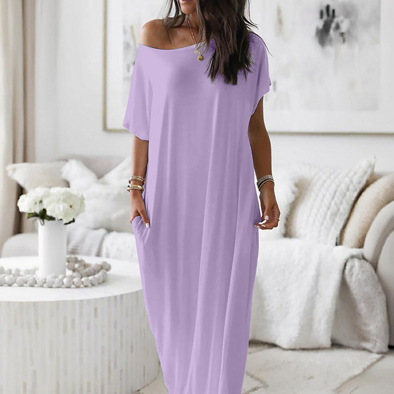 Robe décontractée oversize asymétrique avec décolleté épaule, marque Danoir Paris, tissu fluide et style casual.