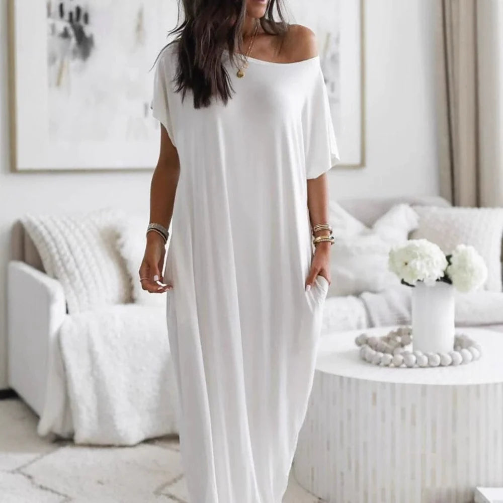 Robe décontractée oversized asymétrique à épaules dénudées de Danoir Paris, tissu léger et style tendance.