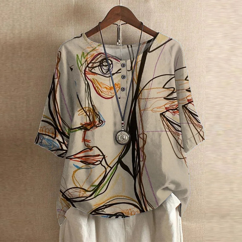 Blouse Anya™ Danoir Paris, style rétro avec col en V et manches longues, tissu léger et élégant.