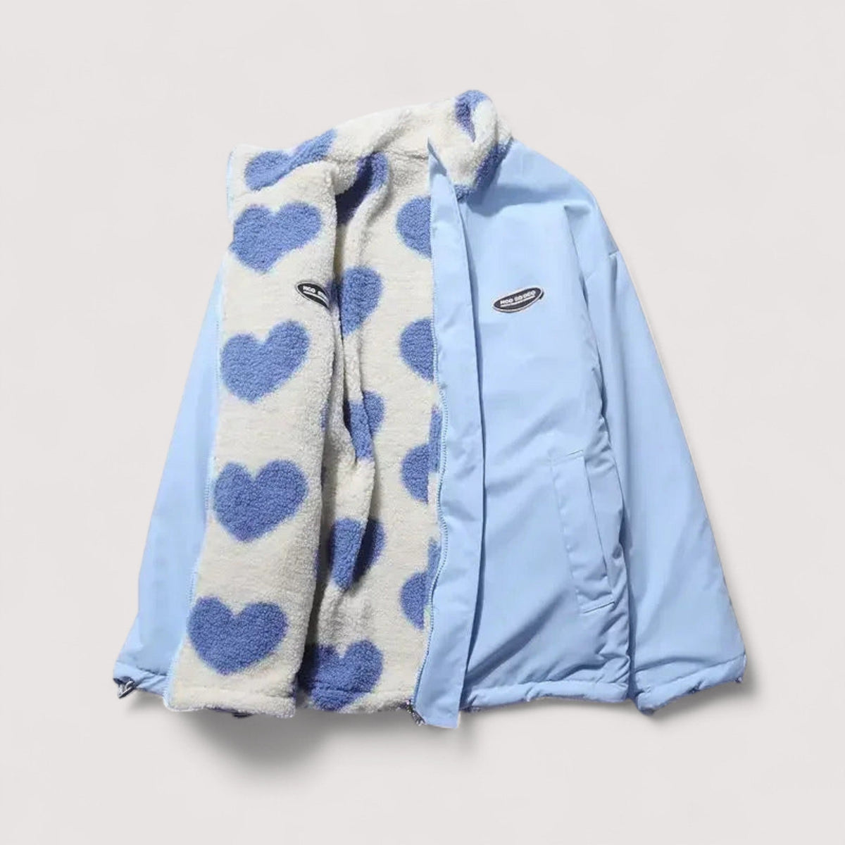 Veste réversible en forme de cœur Amélie de Danoir Paris, tissu coloré, fermeture à boutons, style tendance et confortable.