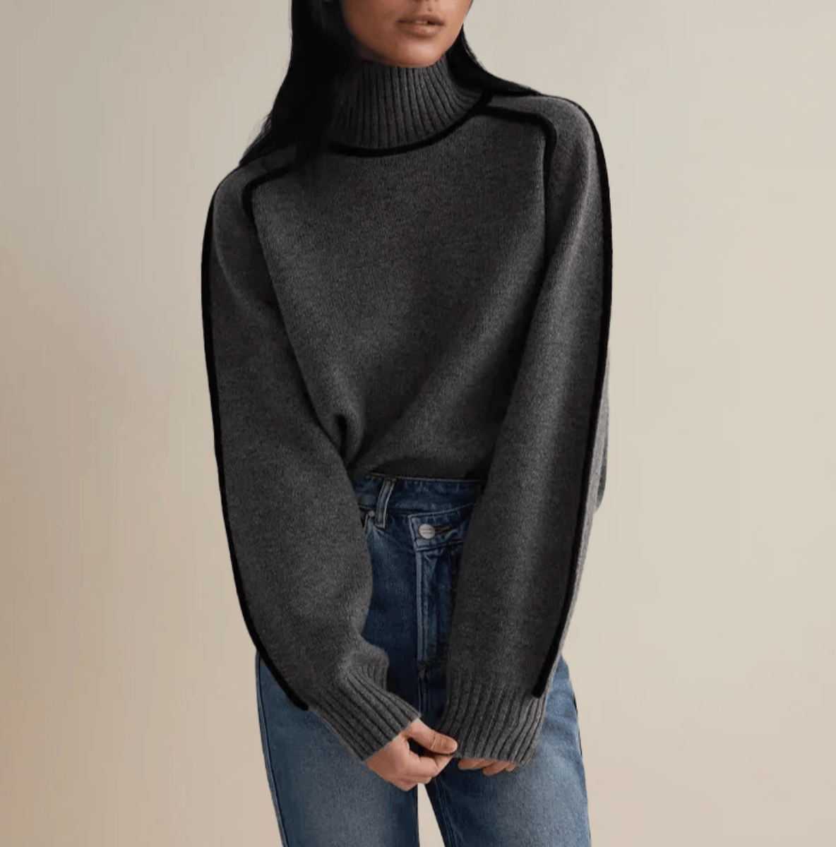 Pull roulé Céline de Danoir Paris, pull en laine gris avec col roulé pour un style chic et confortable.
