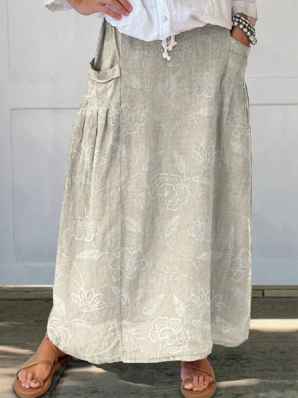 Jupe portefeuille Dally™ à fleurs vintage avec taille élastique et poches, style élégant signé Danoir Paris.