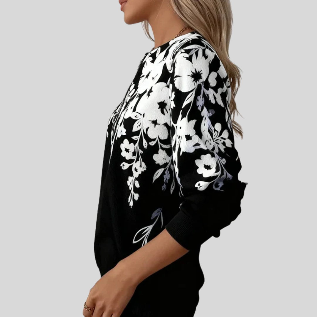 Sweat à col zippé floral Danoir Paris Sheila, sweatshirt confortable avec motif floral coloré sur fond clair.