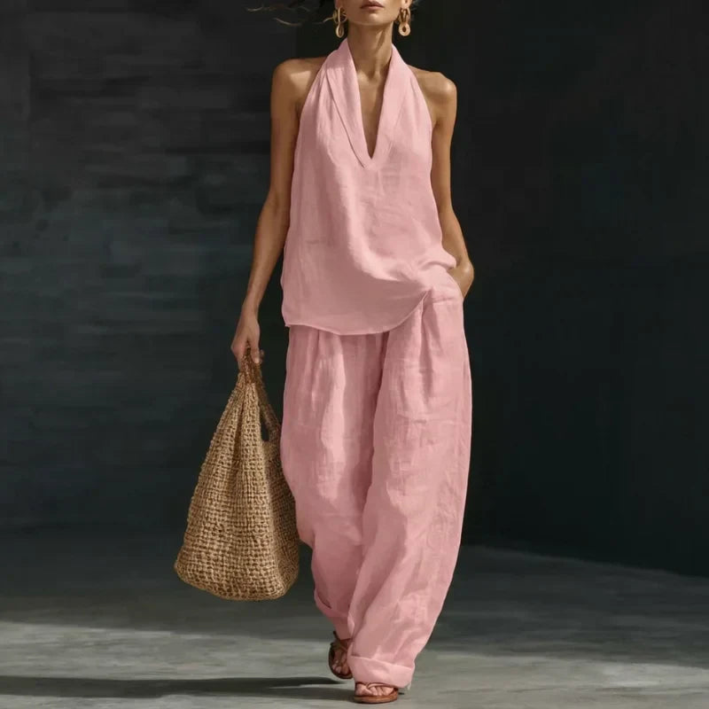 Ensemble deux pièces Ainhoa Danoir Paris en tissu de lino rose, comprenant une blouse et une jupe élégantes.