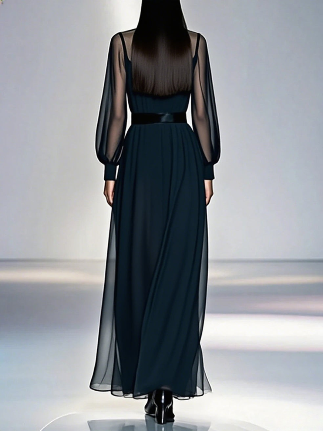 Robe élégante Jimena™ de Danoir Paris, vêtement chic en tissu fluide, portée avec décolleté et manches longues.