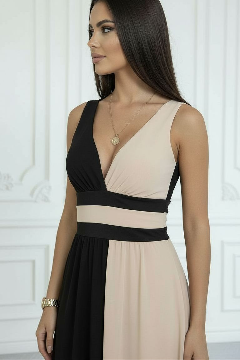 Robe élégante Laura de Danoir Paris, tissu fluide et coupe sophistiquée, portée avec accessoires pour un look chic.