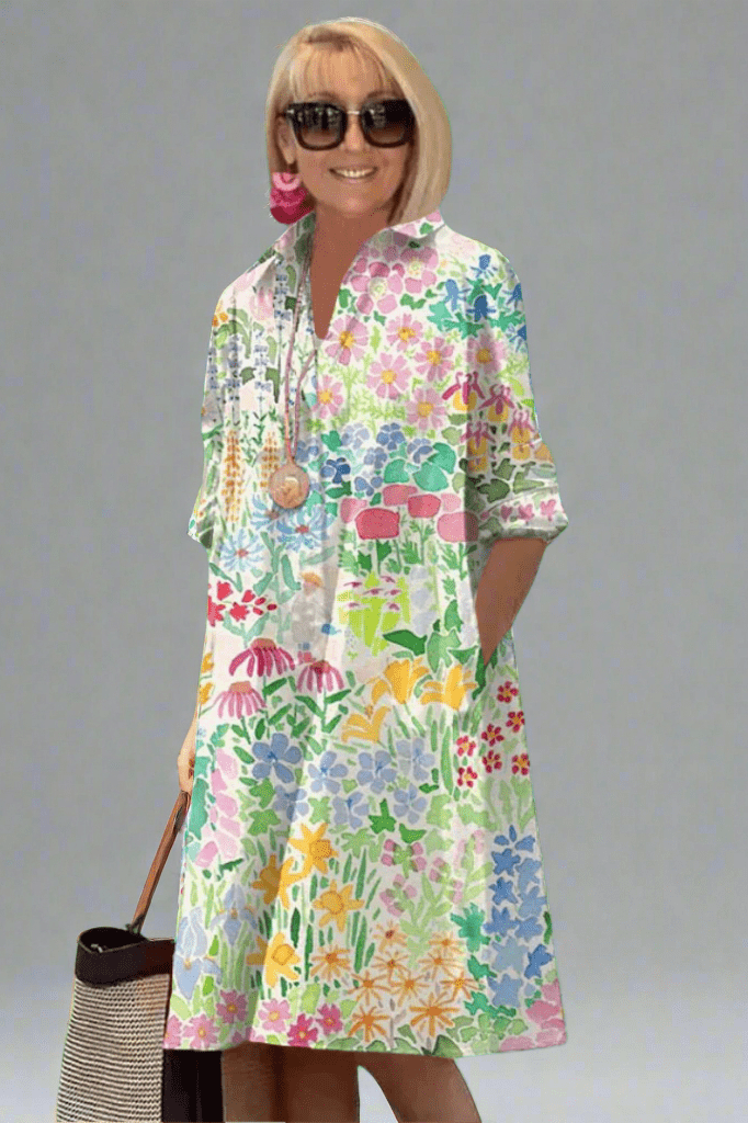 Robe midi élégante Danoir Paris Elisse avec motifs floraux colorés, tissu soigné et coupe sophistiquée.