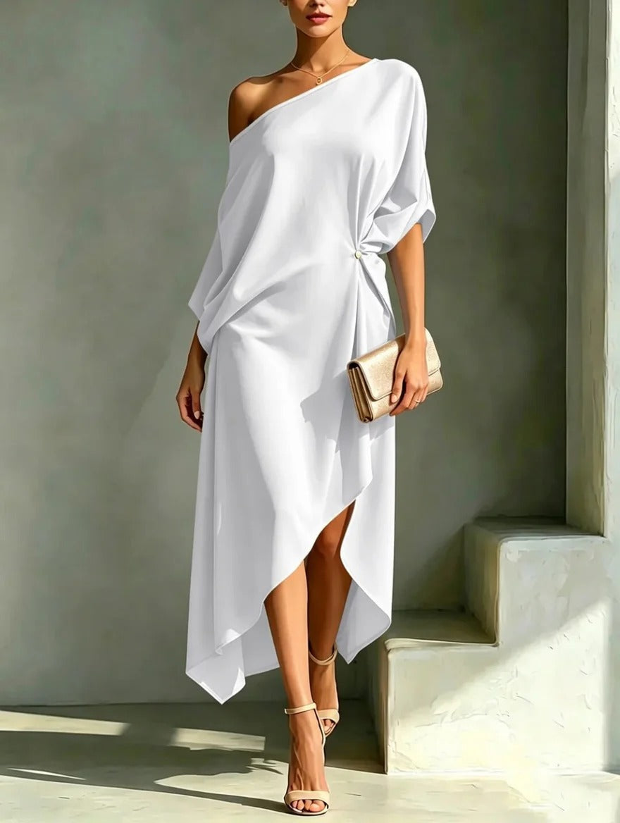 Robe asymétrique élégante Camila de Danoir Paris en tissu jaune avec coupe moderne et détails sophistiqués.