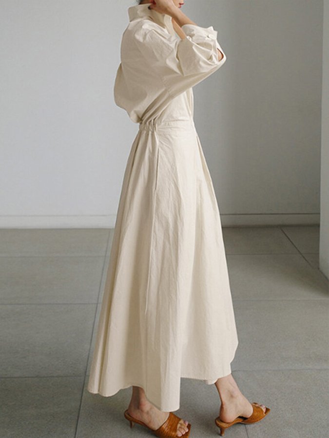Robe longue élégante beige Clémence de Danoir Paris, vue de face avec détails raffinés et coupe fluide.