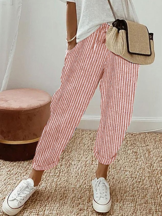 Pantalons fluides beige Danoir Paris, confortables et élégants, avec une coupe décontractée et un tissu léger.