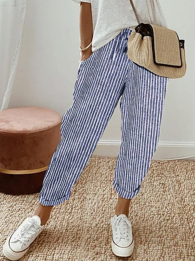 Pantalons fluides beige Danoir Paris, confortables et élégants, en tissu léger, pour un style chic et décontracté.