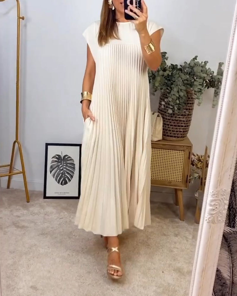 Robe longue élégante Sylvie de Danoir Paris en beige, vue de face, tissu fluide et coude, parfait pour une allure sophistiquée.