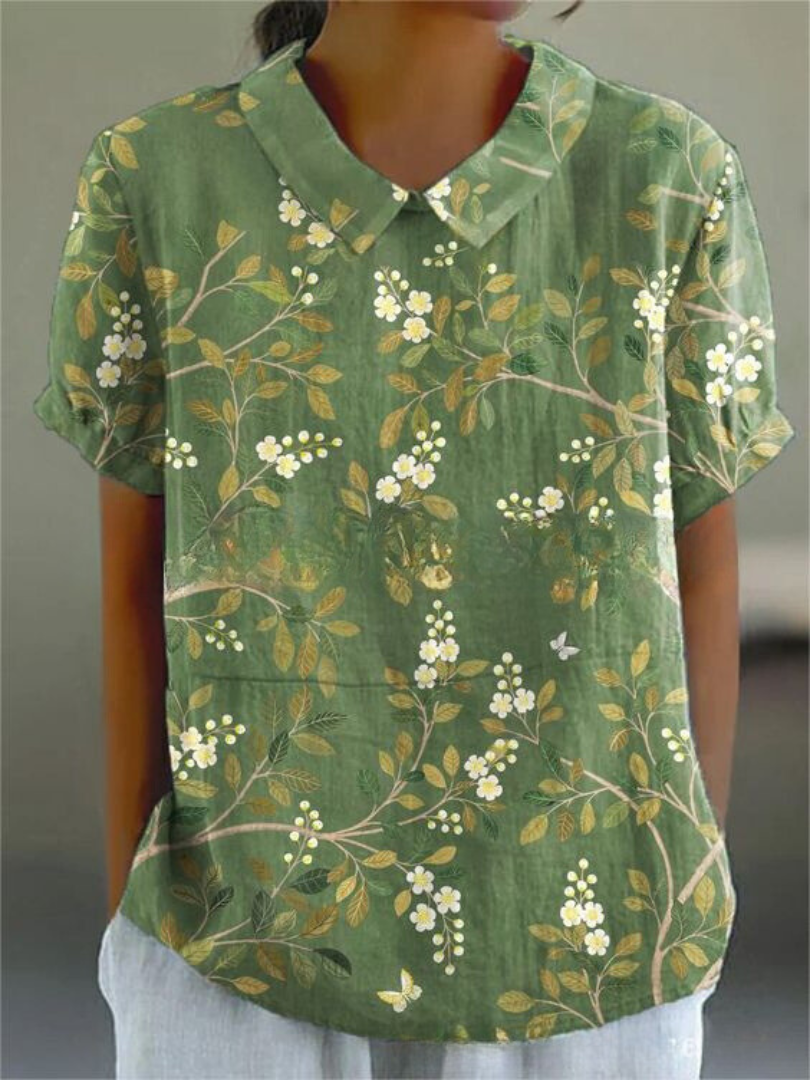 Chemise fleurie élégante Sofia de Danoir Paris, tissu blanc à motifs floraux, style chic et féminin.