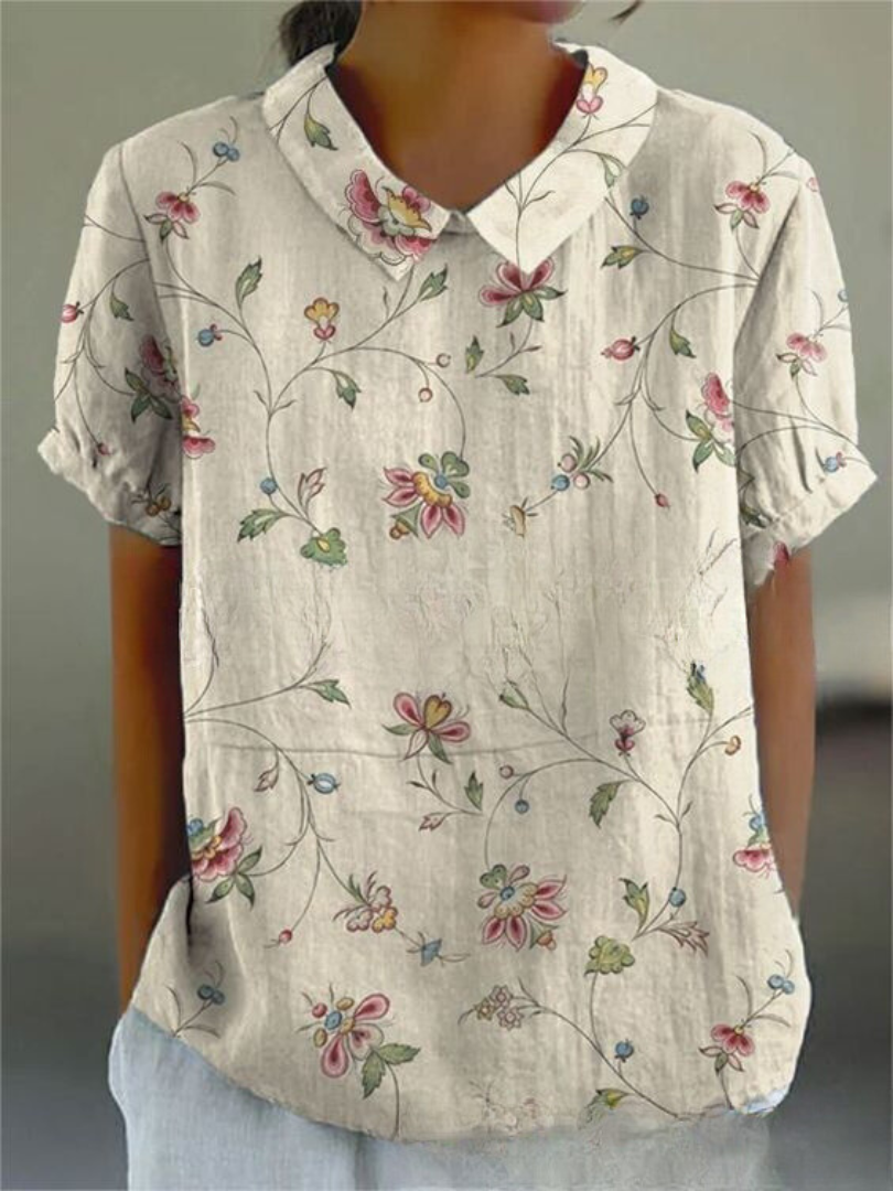 Chemise fleurie élégante Sofia de Danoir Paris avec motif floral blanc, vue de face, tissu léger et style sophistiqué.