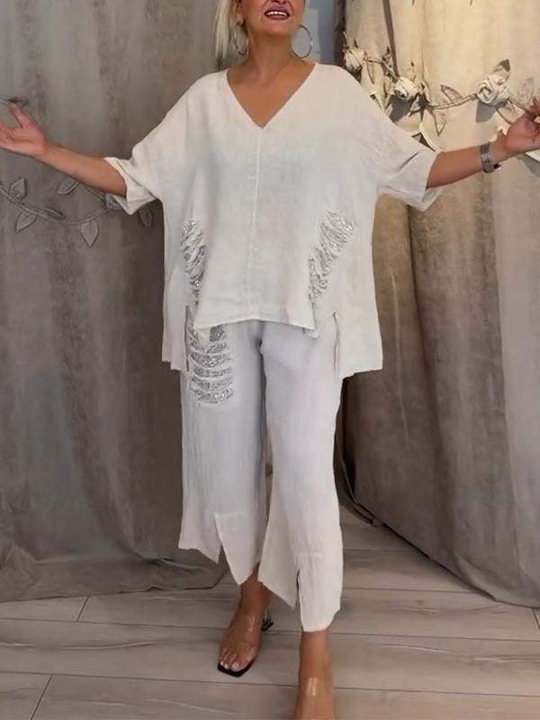 Ensemble deux pièces Bianca pour l'été de Danoir Paris, veste blanche légère et pantalon assorti, parfait pour la saison estivale.