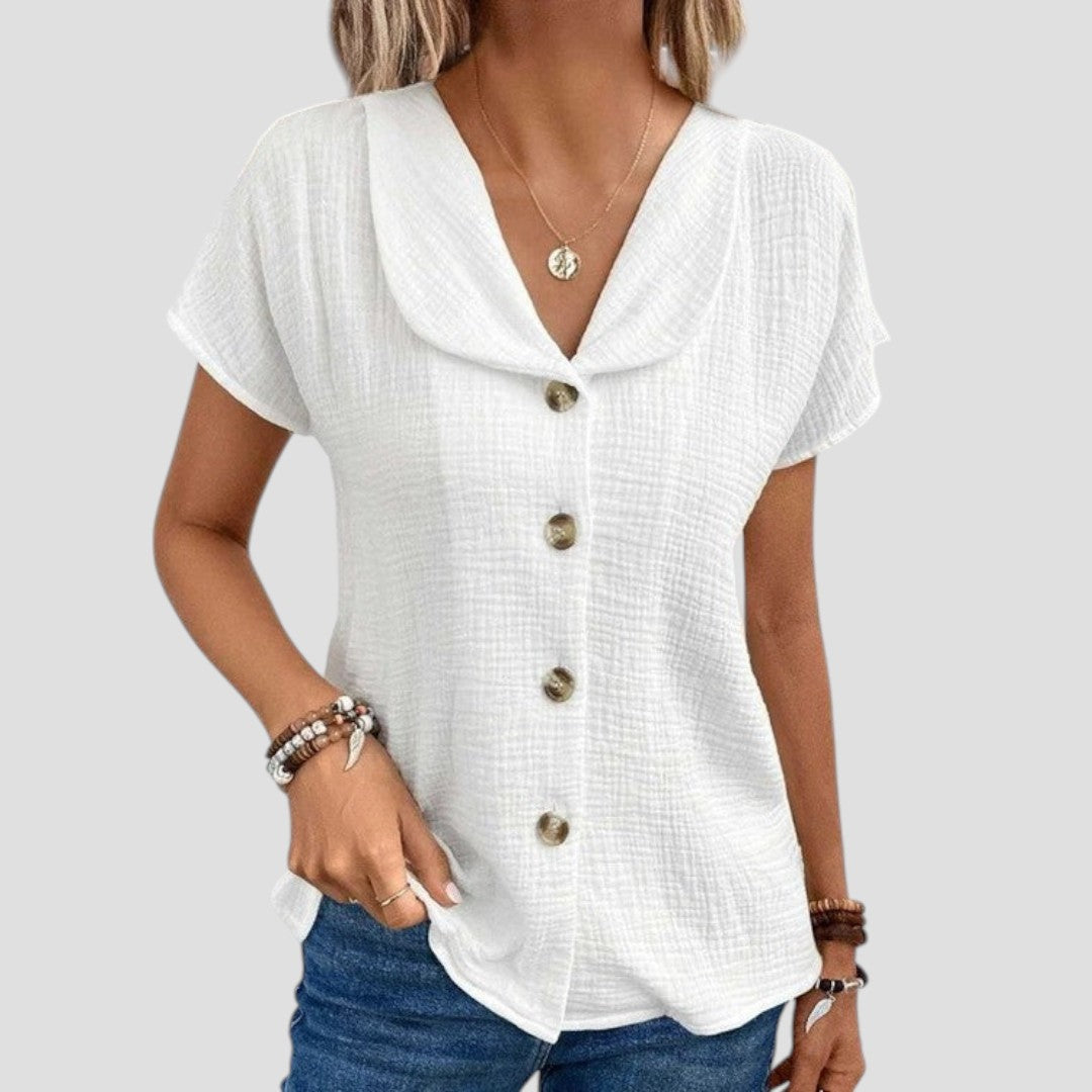 Blouse élégante décontractée Elena de Danoir Paris en tissu blanc, vue de face, avec col et manches longues.