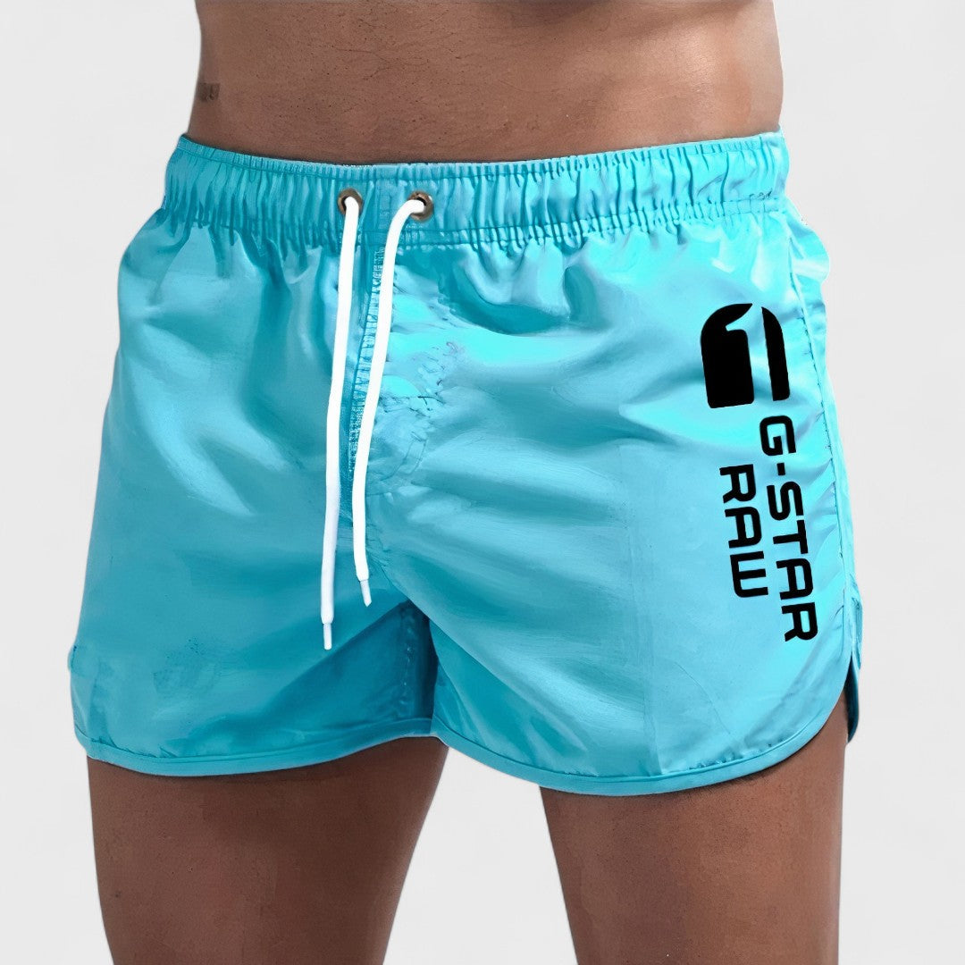 Short de bain homme Laluna® Danoir Paris en tissu bleu, coupe classique, porté sur mannequin, arrière visible.