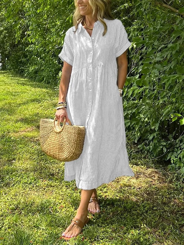 Robe maxi élégante Danoir Paris Angela en tissu bleu avec décolleté et manches longues, vue de face sur fond neutre.