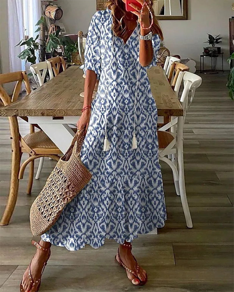 Robe bohémienne légère Dianna de Danoir Paris en tissu bleu avec motifs fluides et décontractés, vue front.