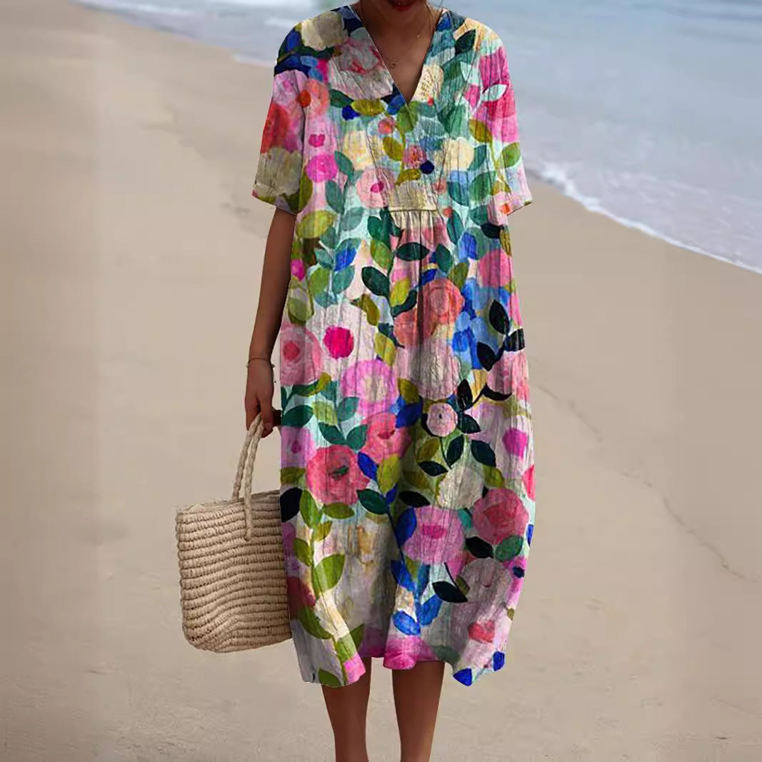 Robe florale éclatante Nicka de Danoir Paris, tissu léger avec motif floral coloré et coupe élégante pour femmes.