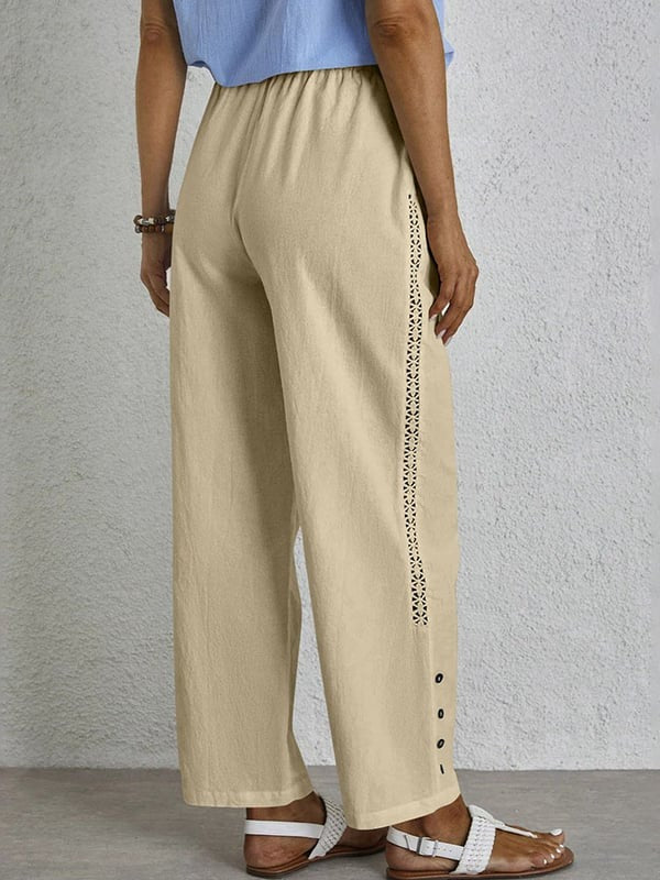 Pantalons relaxés blancs Danoir Paris Sania avec boutons, vue de face, style décontracté et confortable.