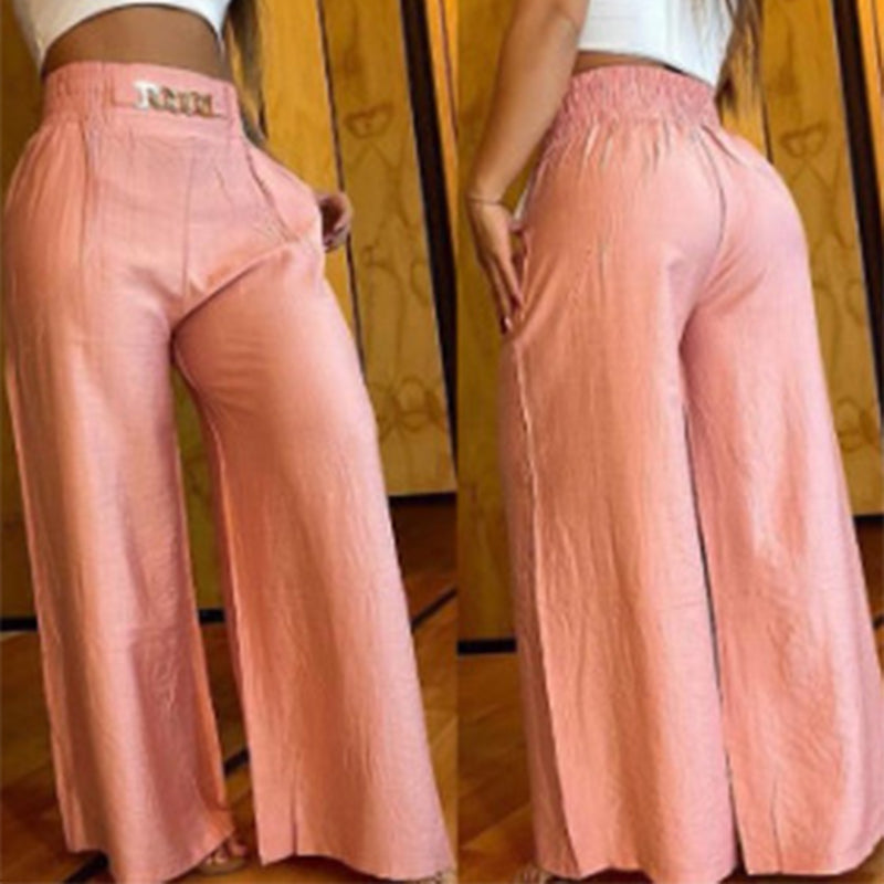 Pantalon large taille haute sculptant Évelyne™ de Danoir Paris, vêtement blanc en tissu fluide, vue de face.