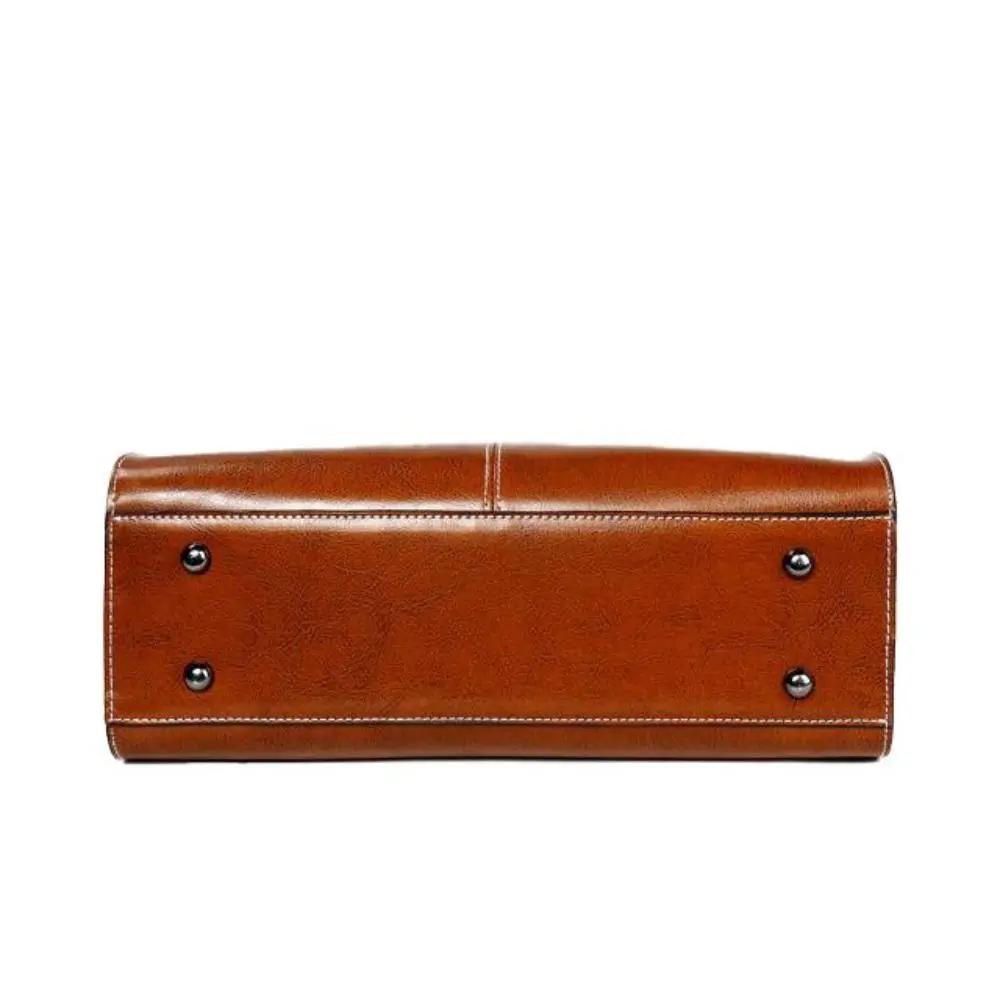 Sac à main Danoir Paris Seraphina en cuir cognac, élégant, intemporel et pratique, avec détails raffinés visibles sur l'image.