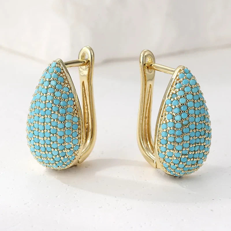 Boucles d'oreilles en forme de goutte turquoise de la marque Danoir Paris, pendantes avec finition élégante.