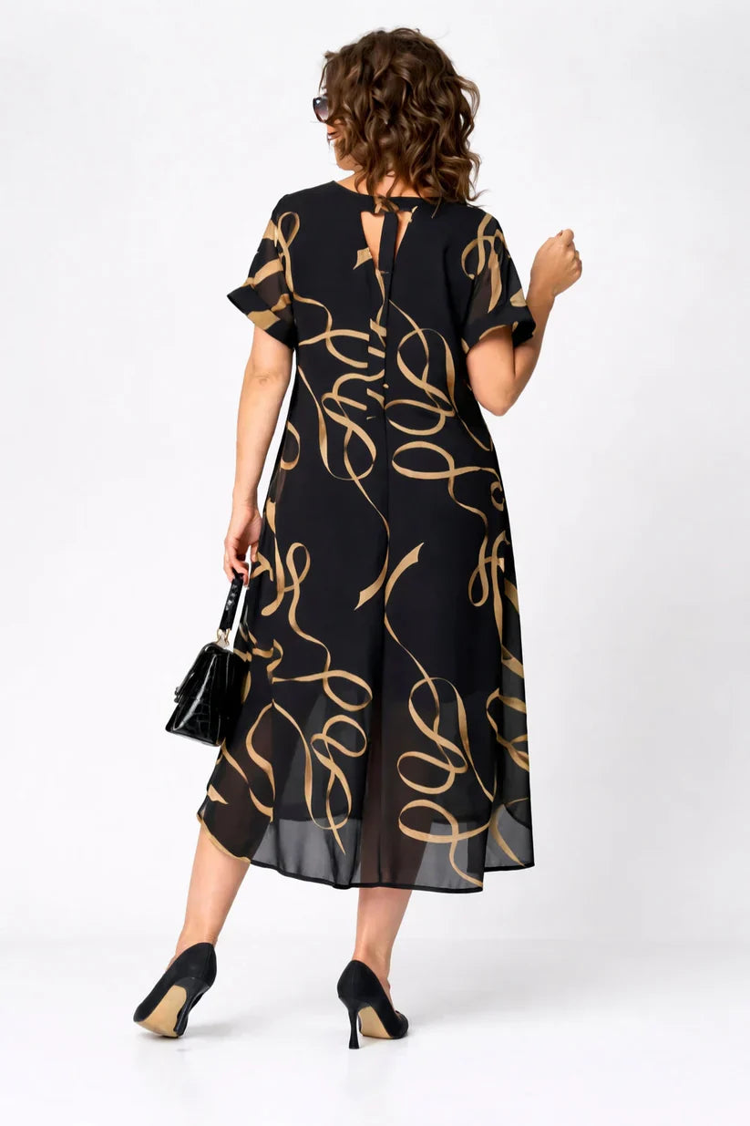 Robe Danoir Paris NORA, élégante et confortable, en tissu doux, avec coupe fluide et détails sophistiqués.