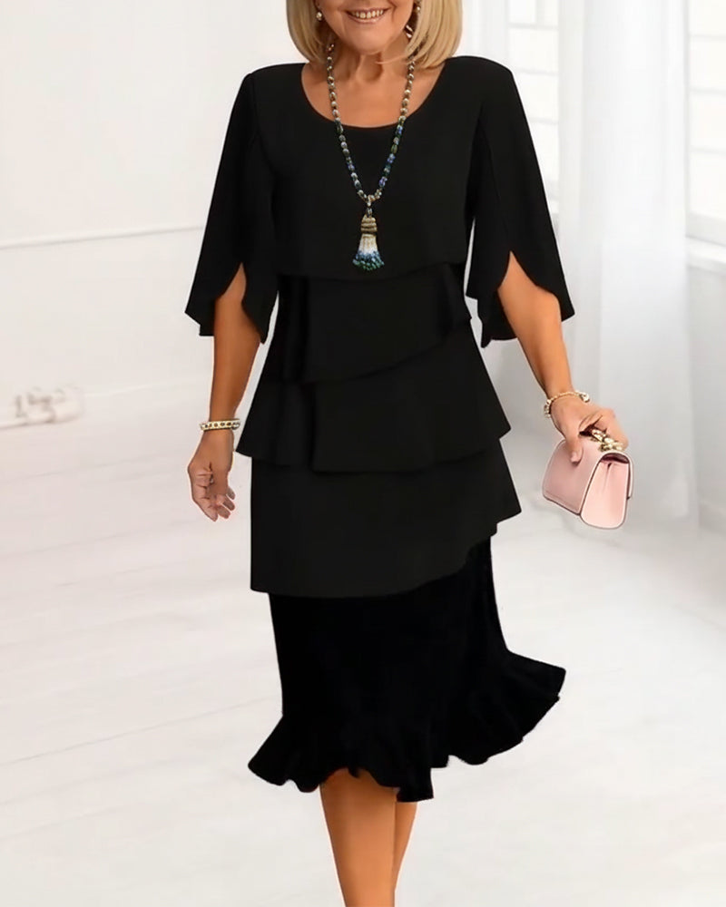 Robe fluide noire Sophie de Danoir Paris avec volants élégants, idéale pour une tenue sophistiquée et féminine.