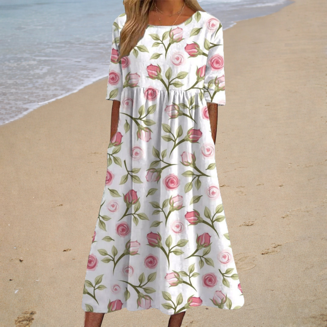 Robe midi romantique blanche Aurélie de Danoir Paris, robe élégante pour femmes, détails floraux et coupe fluide visible.