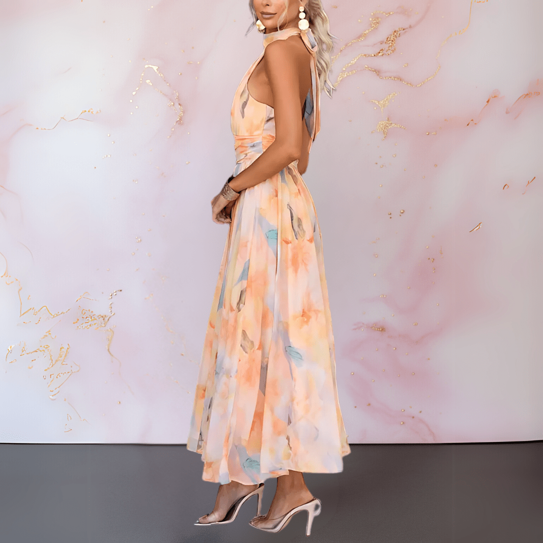 Robe imprimée à aquarelle orange Esther de Danoir Paris avec col halter, robe élégante et fluide pour l'été.
