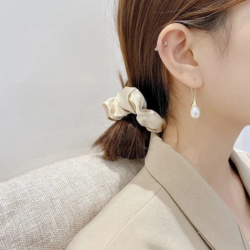 Boucles d'oreilles classiques en perles de la marque Danoir Paris, élégantes et raffinées pour un look sophistiqué.
