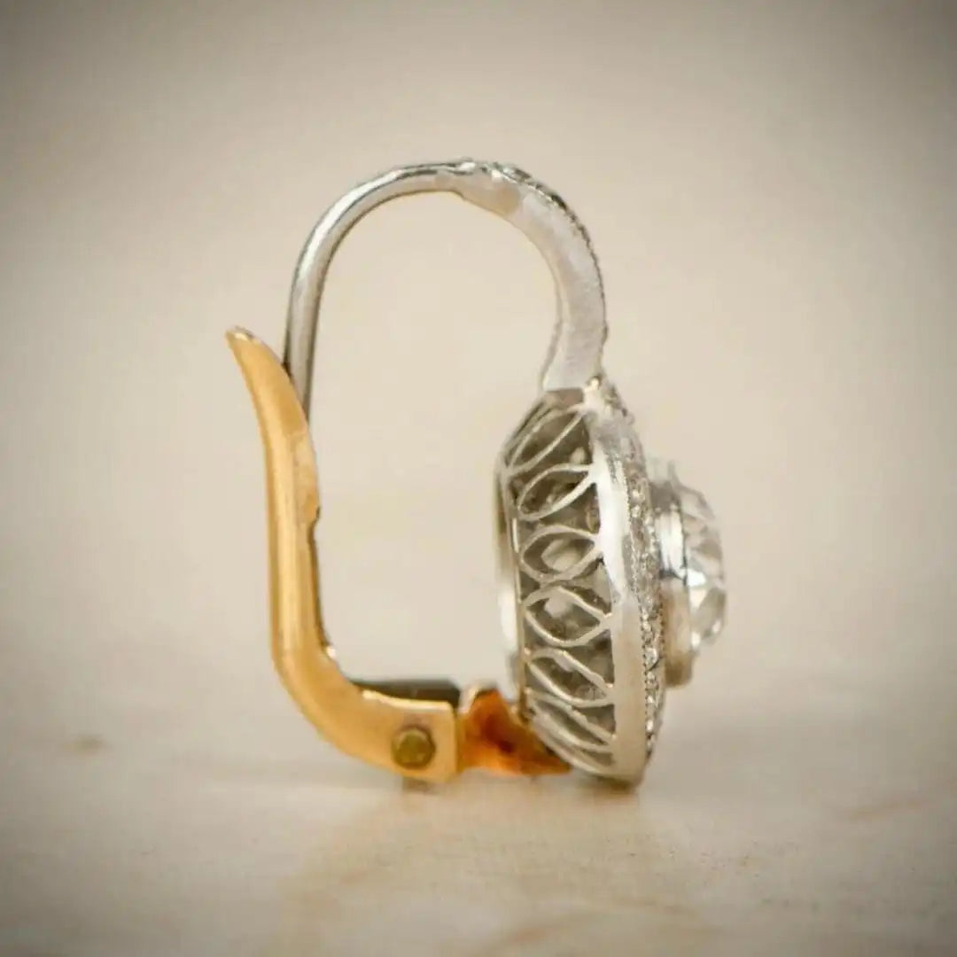 Boucles d'oreilles vintage en or et argent avec cristaux de Danoir Paris, élégantes et raffinées.