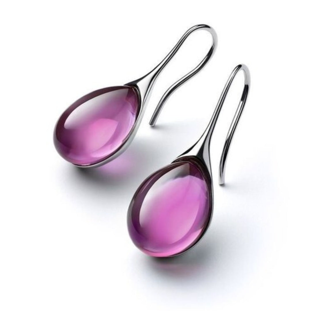 Boucles d'oreilles pendantes Danoir Paris en or bleu avec cristaux, élégantes et chics pour un look sophistiqué.