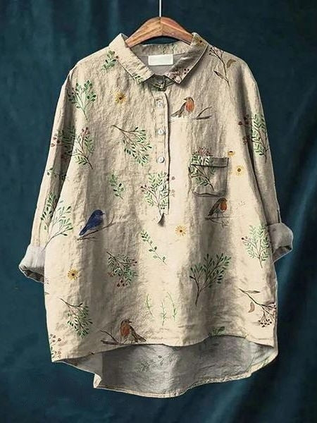 Blouse florale élégante Lila de Danoir Paris, tissu léger, motifs floraux colorés, ajustée avec manches longues.