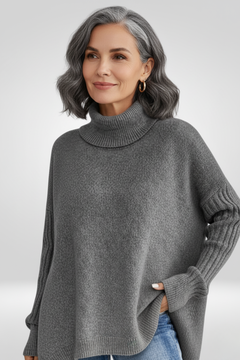 Pull asymétrique beige Danoir Paris Isabelle, style chic, porté sur mannequin, détails du design moderne et élégant.