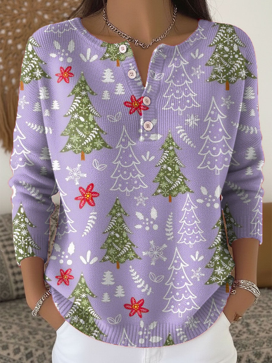 Pull de Noël festif Sofie de Danoir Paris, en vert, avec motifs de fête, porté sur mannequin.