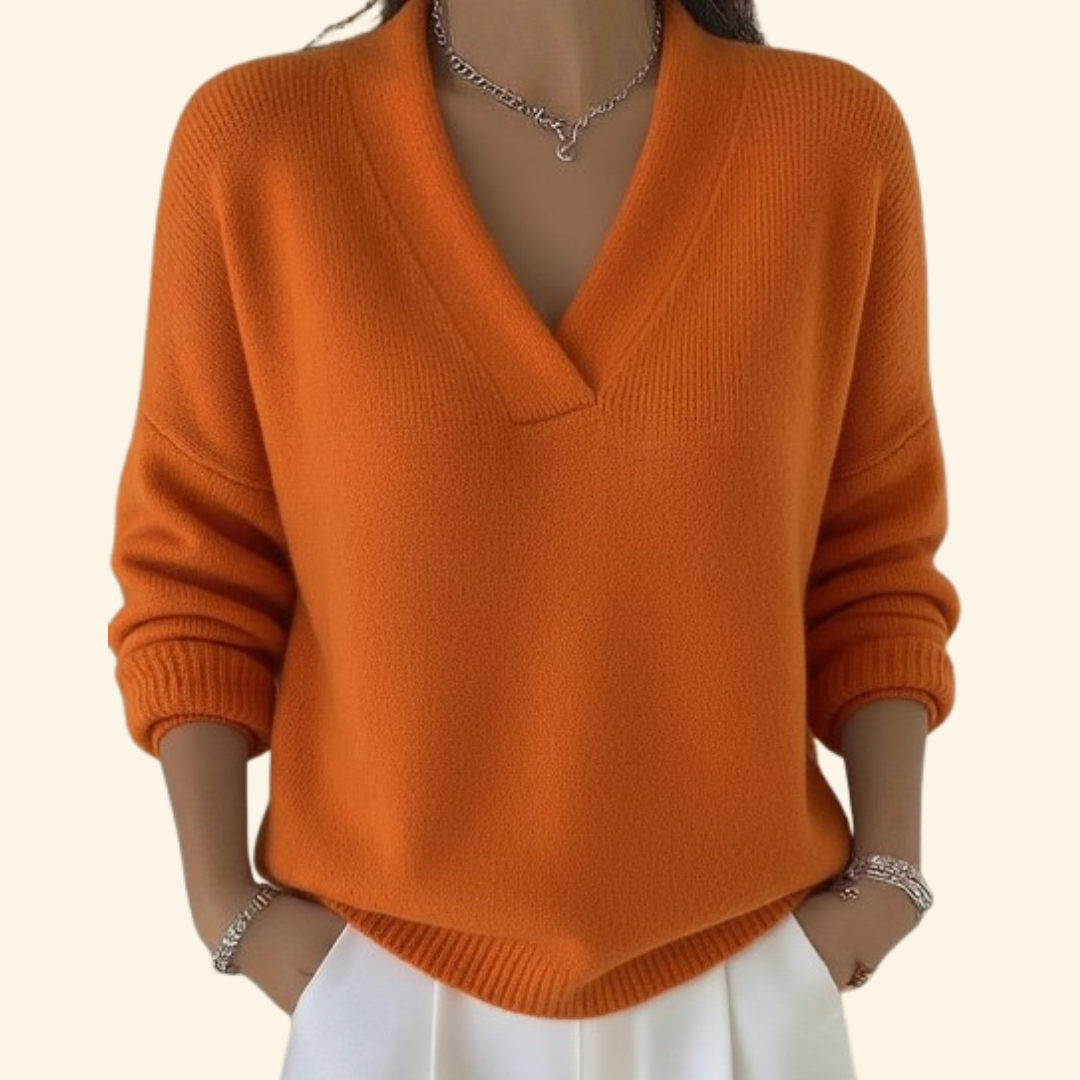 Pull Noor Danoir Paris en rouge, confortable et élégant, avec un style moderne et tissu doux visible sur l'image.