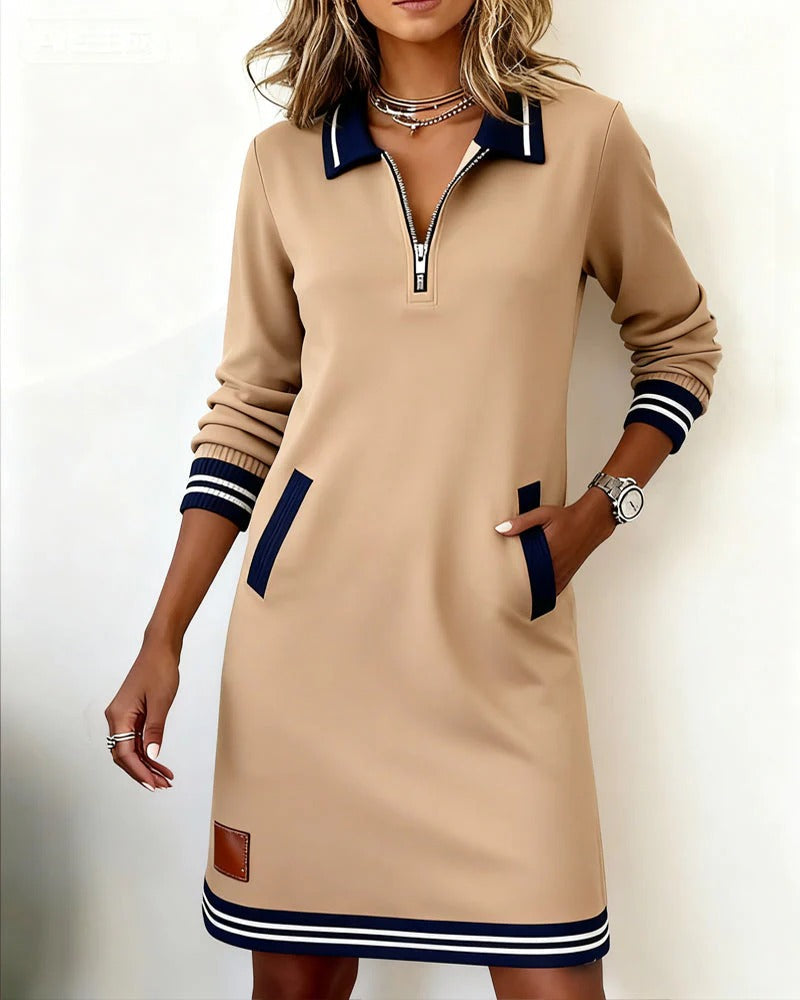 Robe Sporty-Chic Nadege de Danoir Paris, gris, en tissu élégant, portée courte, style moderne et sophistiqué.