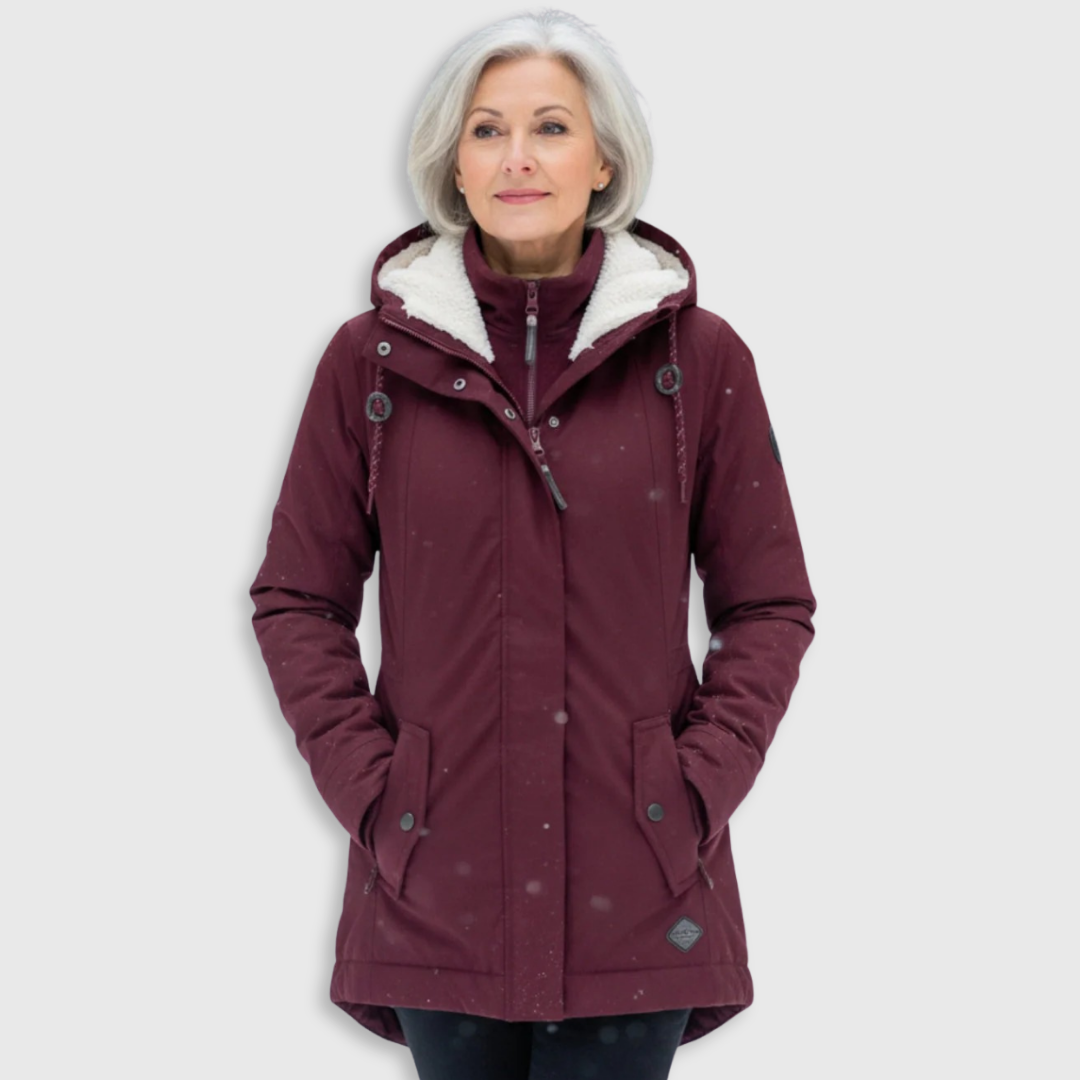 Parka réversible élégante Amelia de Danoir Paris en rouge, veste à la coupe sophistiquée, visible avec détails de tissu et fermeture éclair.