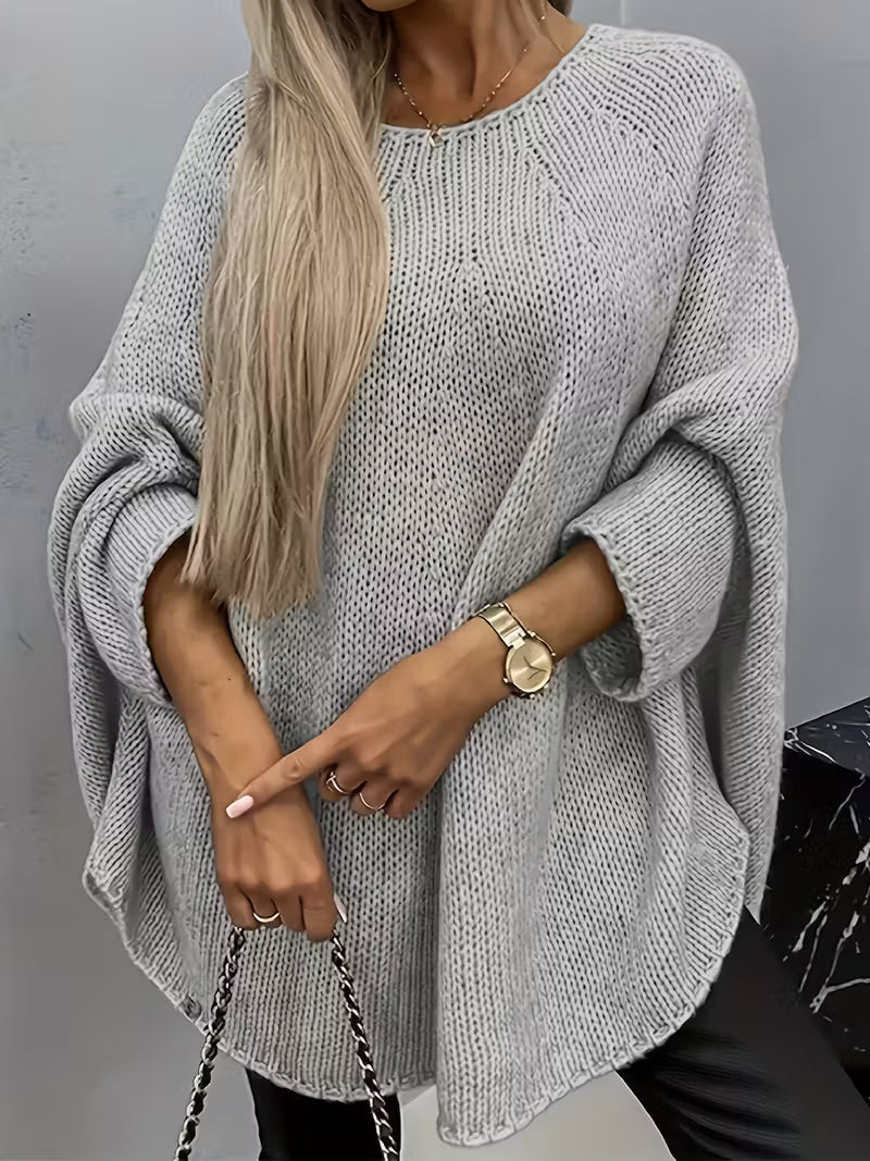 Gilet tricoté élégant Betsi de Danoir Paris en beige, porté avec détails visibles, pour un look sophistiqué.